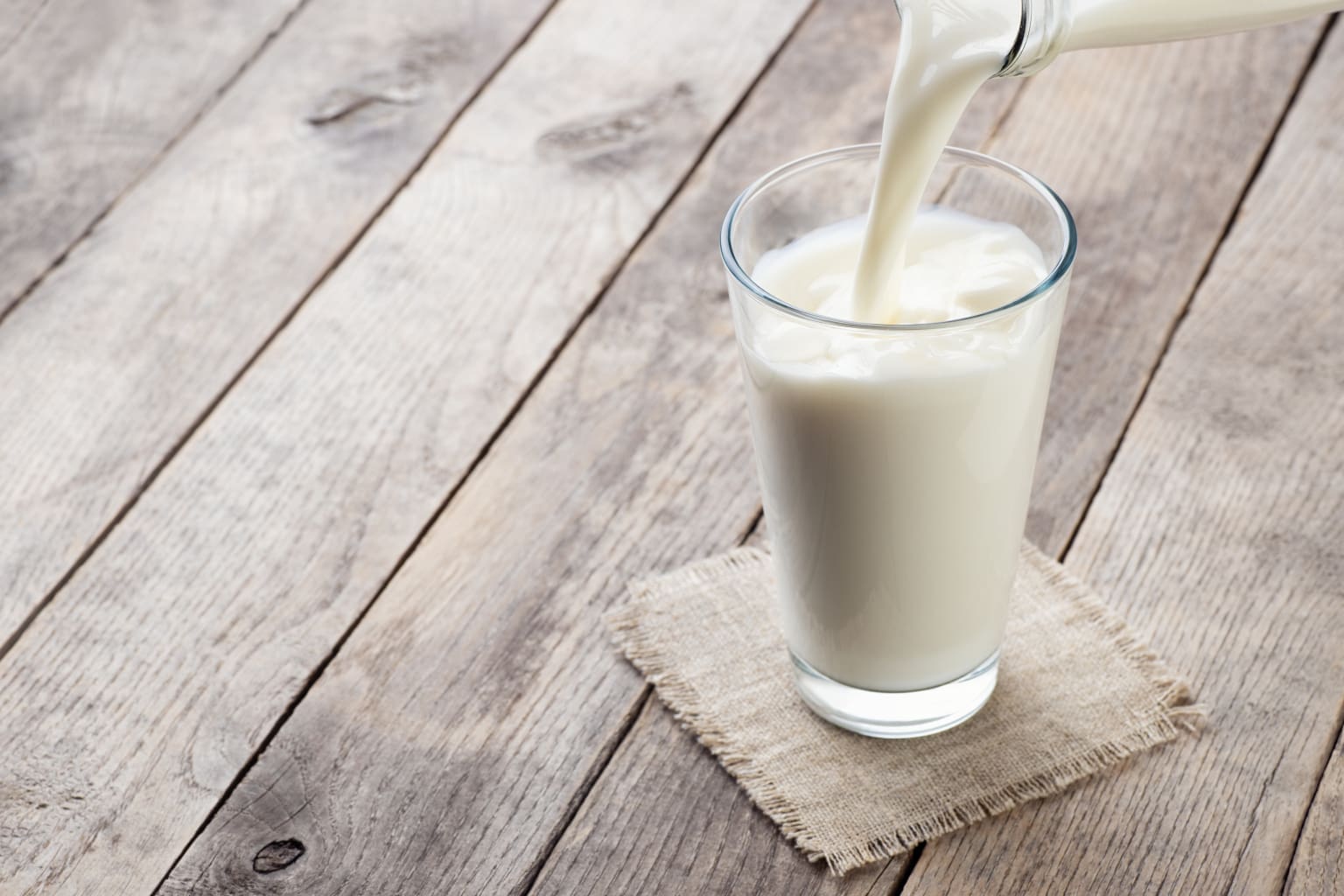 She drinks milk every day. Молочный коктейль с собой. Стакан молока вид сверху. Glass of Milk.